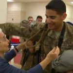 Soldiers Wait In Line For the Hug Lady