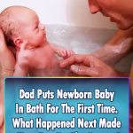 Newborn Baby takes his first bath