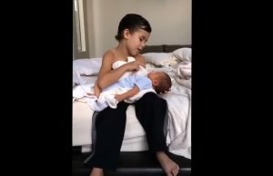 Heartwarming scene, six-year-old big brother, newborn baby brother, sibling love, serenade, bonding through music, touching moment, unbreakable sibling bond, innocence and tenderness, expressions of affection