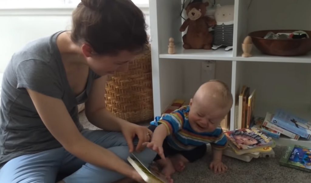 baby, mom, reading a story, emotional reaction, crying, video, heartwarming, bond, tender moments