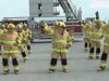 Stayin' Alive, Firefighters, Flashmob Dance, CPR, Chest Compressions, Heart Health, Bee Gees, Public Awareness, Educational, Entertainment, Fun, Engagement, Firefighter Gear, Props, Popular Culture, TV Shows, Ellen Show, America's Got Talent, Stayin' Alive, firefighter flashmob dance, CPR awareness, heart health awareness, Bee Gees, chest compressions, public health awareness, fire department, first responders, pop culture, TV appearances, unique dance routine, engaging education, life-saving skills, public safety awareness