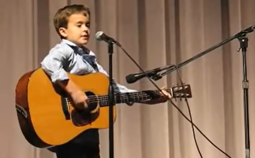 Guitar Prodigy, Little Johnny Cash, Folsom Prison Rendition, Guitar Performance, Second Grader Talent, School Concert, Talented Kids, Future of Music, Budding Star, Unique Guitar Talent.