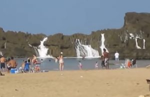 Puerto Nuevo Beach, Vega Baja, Craggy rock formation, Serene lagoon, Pristine shoreline, Natural wonders, Protective barrier, Hidden gem, Land and sea, Perfect getaway.