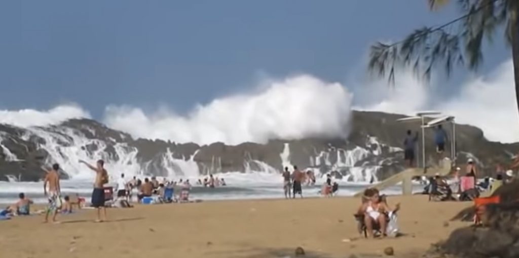 Puerto Nuevo Beach, Vega Baja, Craggy rock formation, Serene lagoon, Pristine shoreline, Natural wonders, Protective barrier, Hidden gem, Land and sea, Perfect getaway.