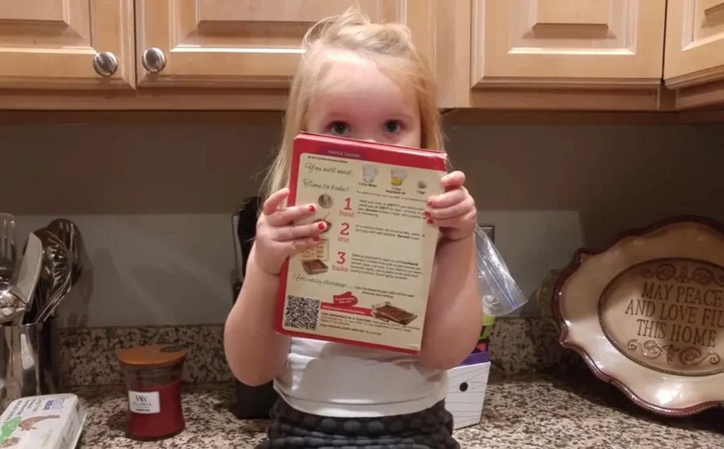 3-year-old guides dad baking, Betty Crocker brownies tutorial, funny brownie baking video, hilarious baking with kids, viral kid baking video, dad and daughter cooking moment, chaotic kitchen adventure, child baking instructions, funny family baking stories, baking with toddlers