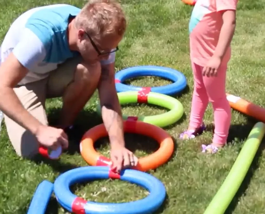 DIY pool noodle obstacle course, pool noodle obstacle course, obstacle course for kids, physical activity for children, fun and active play, creative play ideas, family bonding activities, kids' obstacle course, affordable DIY projects, pool noodle games