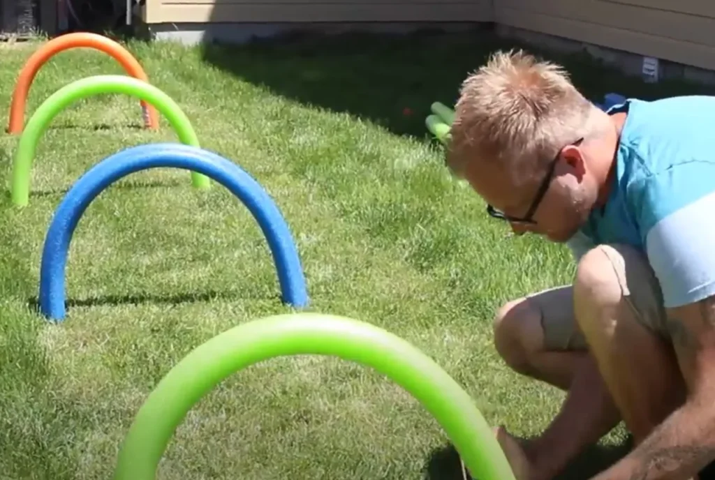 DIY pool noodle obstacle course, pool noodle obstacle course, obstacle course for kids, physical activity for children, fun and active play, creative play ideas, family bonding activities, kids' obstacle course, affordable DIY projects, pool noodle games