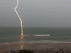 slow-motion lightning footage, slow-motion lightning, lightning strike video, Florida lightning, beach lightning strike, nature footage, slow-motion nature, lightning over water, dramatic lightning, lightning photography, nature's power, slow-motion beach
