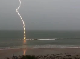 slow-motion lightning footage, slow-motion lightning, lightning strike video, Florida lightning, beach lightning strike, nature footage, slow-motion nature, lightning over water, dramatic lightning, lightning photography, nature's power, slow-motion beach