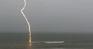 slow-motion lightning footage, slow-motion lightning, lightning strike video, Florida lightning, beach lightning strike, nature footage, slow-motion nature, lightning over water, dramatic lightning, lightning photography, nature's power, slow-motion beach