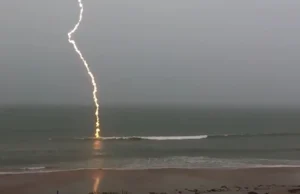 slow-motion lightning footage, slow-motion lightning, lightning strike video, Florida lightning, beach lightning strike, nature footage, slow-motion nature, lightning over water, dramatic lightning, lightning photography, nature's power, slow-motion beach