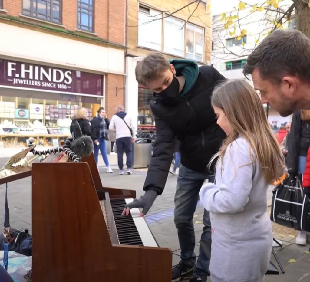 street performance, public piano, overcoming stage fright, Joe Jenkins, young pianist, street pianist, building confidence, calming techniques, street crowd, music performance, breathing exercises, visualization, managing nerves, YouTube pianist, piano performance