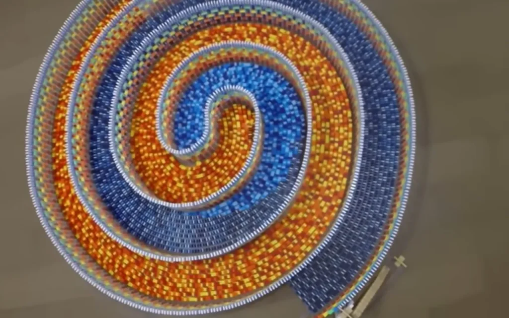 15,000 dominoes, Triple spiral, Domino art, Hevesh5, Domino chain reaction, Hypnotic domino fall, Domino masterpiece, Creative domino design, Domino artist, 25 hours setup