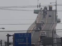 Eshima Ohashi Bridge, roller-coaster bridge, Japan's largest rigid-frame bridge, steep incline bridge in Japan, thrilling bridge experience, Eshima Ohashi tourist attraction, Shimane Prefecture bridge, Tottori Prefecture bridge, engineering marvel in Japan, Japan's roller-coaster bridge design