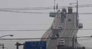 Eshima Ohashi Bridge, roller-coaster bridge, Japan's largest rigid-frame bridge, steep incline bridge in Japan, thrilling bridge experience, Eshima Ohashi tourist attraction, Shimane Prefecture bridge, Tottori Prefecture bridge, engineering marvel in Japan, Japan's roller-coaster bridge design