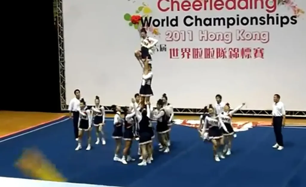 Team Japan cheerleading, World Cheerleading Championships 2011, All-female squad, Incredible routine, Perfect synchronization, Strength and agility, Unbelievable performance, Human pyramid, Defying gravity, Cirque du Soleil-level stunts