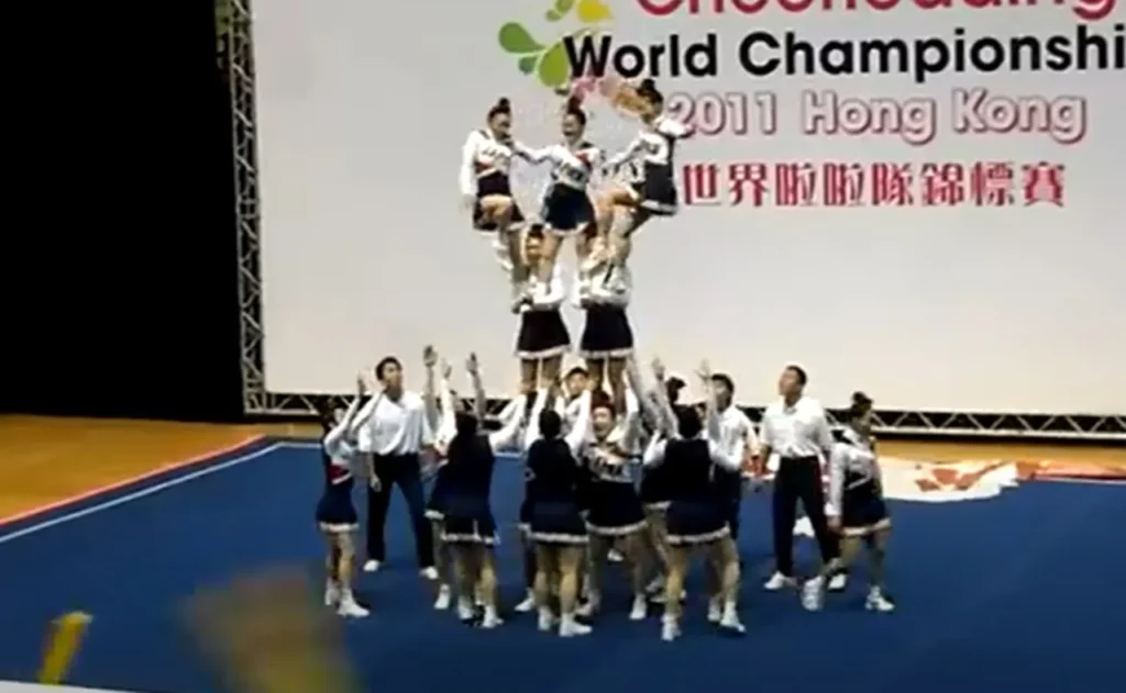 Team Japan cheerleading, World Cheerleading Championships 2011, All-female squad, Incredible routine, Perfect synchronization, Strength and agility, Unbelievable performance, Human pyramid, Defying gravity, Cirque du Soleil-level stunts