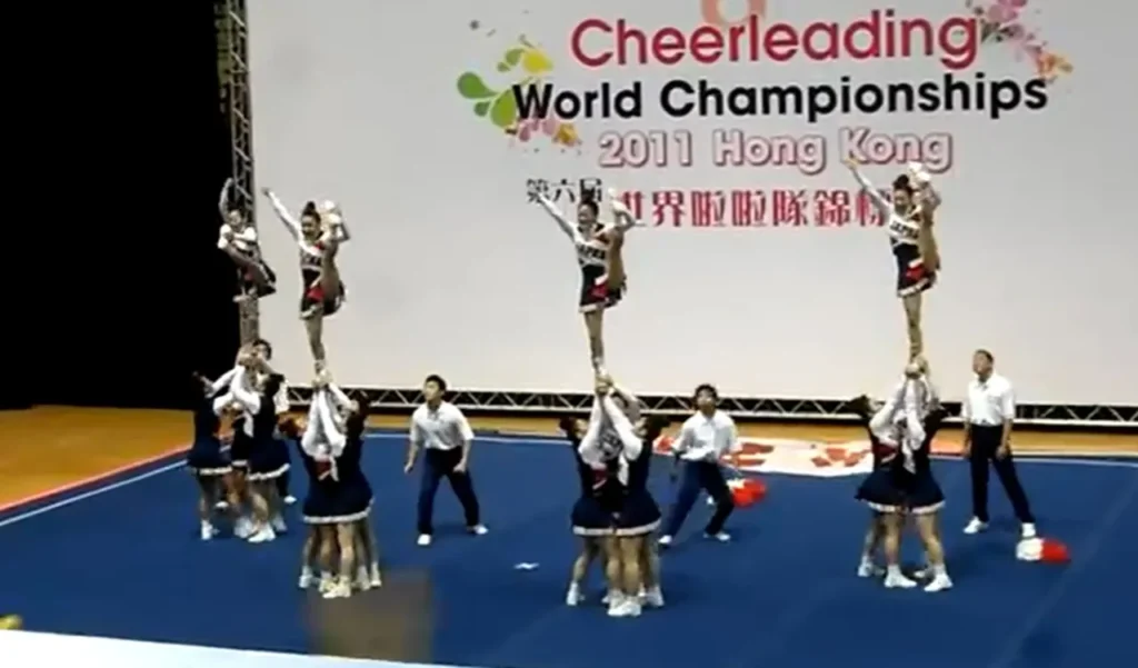 Team Japan cheerleading, World Cheerleading Championships 2011, All-female squad, Incredible routine, Perfect synchronization, Strength and agility, Unbelievable performance, Human pyramid, Defying gravity, Cirque du Soleil-level stunts