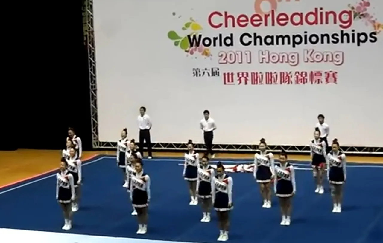 Team Japan cheerleading, World Cheerleading Championships 2011, All-female squad, Incredible routine, Perfect synchronization, Strength and agility, Unbelievable performance, Human pyramid, Defying gravity, Cirque du Soleil-level stunts