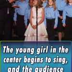The young girl in the center begins to sing