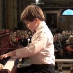 Accompanied by His Teddy bear This kid came to play Beethoven