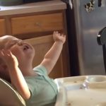 This father sings National Anthem with his baby girl
