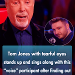 Tom Jones with tearful eyes stands up and sings