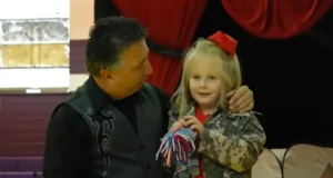 Military family reunion, School magic show surprise, Emotional reunion, Military sacrifices, Soldiers surprise daughter, Heartwarming moment, Tearful reunion, Surprise at school, Reunited family, Joyful homecoming