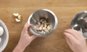 peeling garlic, garlic techniques, garlic preparation, garlic tips, cooking garlic, garlic methods, garlic slicing, garlic crushing, garlic chopping, roasted garlic