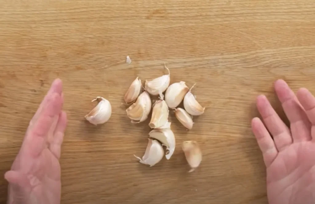 peeling garlic, garlic techniques, garlic preparation, garlic tips, cooking garlic, garlic methods, garlic slicing, garlic crushing, garlic chopping, roasted garlic