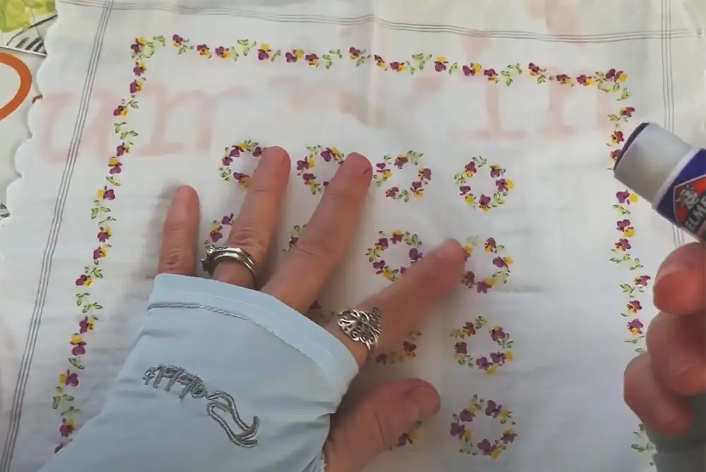 Glue lace trim, fabric scraps, or pressed flowers to covers. Create interior pockets from envelope scraps.