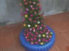 upcycled garden, bottle planter, DIY garden, vertical garden, Portulaca, moss rose, eco-friendly, balcony garden, small space, gardening