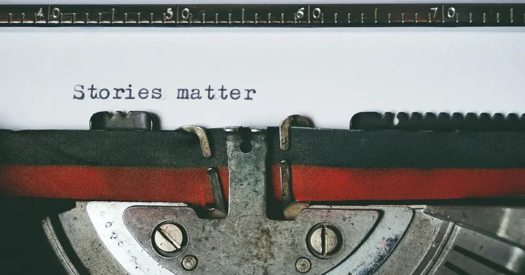 Close-up of a vintage typewriter with the text'Stories matter' typed on paper, evoking nostalgia. Every voice matters