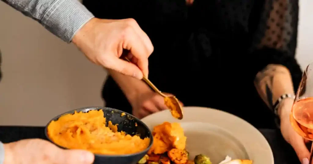 Close-up of a festive dinner with people enjoying a delicious meal together..