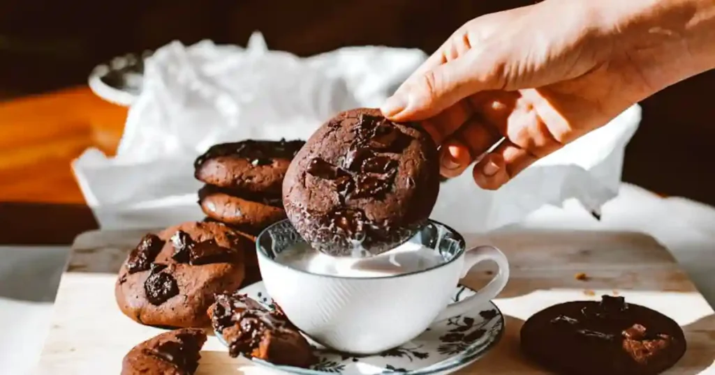 Delicious homemade chocolate chip cookies with milk, perfect for a sweet snack..