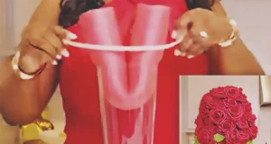 A DIY wedding centerpiece made from a pool noodle and floral materials, styled to look elegant and high end for wedding table decor.