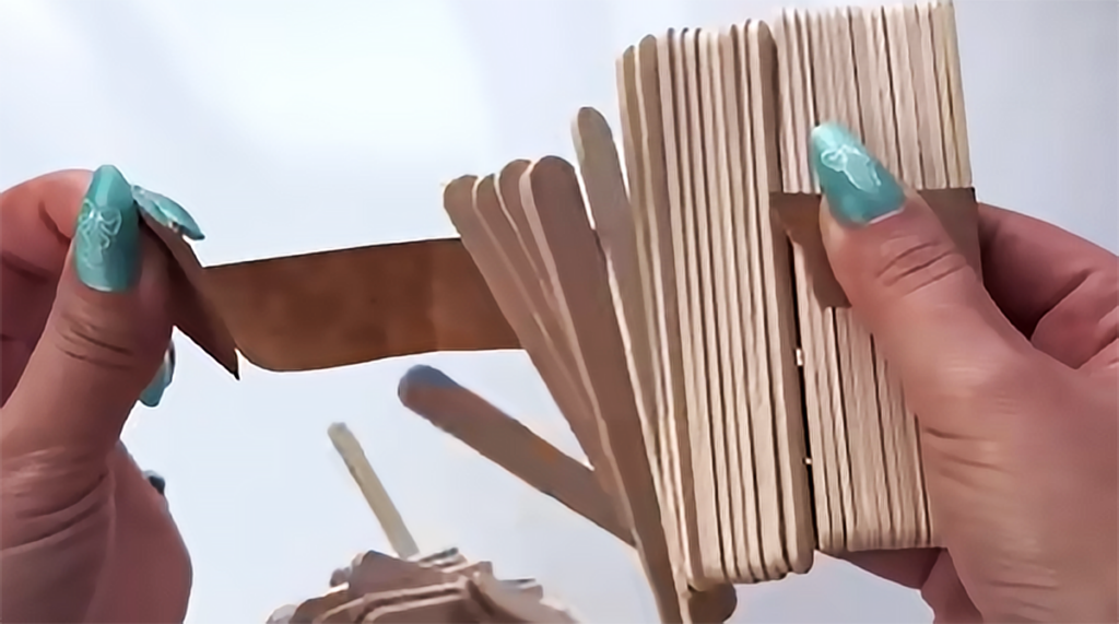 A handmade elegant treasure box made with wooden craft sticks, designed as a DIY jewelry box and small keepsake organizer for gifts, storage, or desk decor.