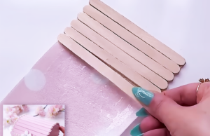 A handmade elegant treasure box made with wooden craft sticks, designed as a DIY jewelry box and small keepsake organizer for gifts, storage, or desk decor.