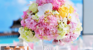 DIY wedding table centerpiece with a simple elegant upgraded look, styled for a romantic reception table with soft florals, candles, and polished wedding decor.