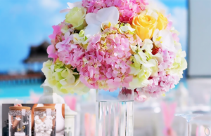 DIY wedding table centerpiece with a simple elegant upgraded look, styled for a romantic reception table with soft florals, candles, and polished wedding decor.