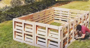 A DIY backyard pool project made from old wooden pallets, showing an upcycled outdoor build that transforms discarded materials into a creative summer pool idea.