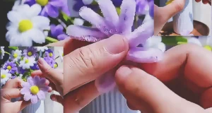 A DIY craft tutorial showing how to make decorative flowers from pipe cleaners for gifts, handmade decor, or easy floral projects.