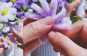 A DIY craft tutorial showing how to make decorative flowers from pipe cleaners for gifts, handmade decor, or easy floral projects.