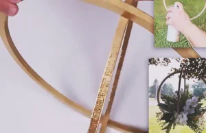 A Dollar Tree wedding decor DIY using wooden rings and a metallic gold finish to create elegant floral decor or centerpiece styling for a budget-friendly wedding.