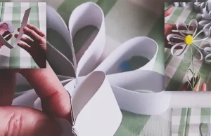 A handmade paper daisy garland made from simple paper strips, styled as cheerful spring decor for a wall, shelf, mantel, or party setup.