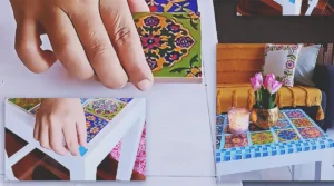 A DIY wooden stool makeover transformed into a stylish tile-top decor piece with a clean, modern, Pinterest-inspired look for budget home decor.