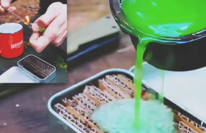 A homemade camping fire starter made from corrugated cardboard soaked in green melted wax and stored in a small metal tin, with one piece being lit outdoors.