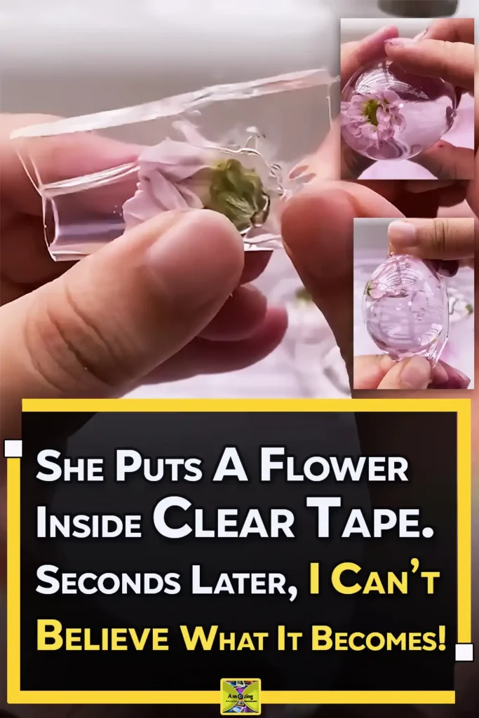 Hands making a clear nano tape flower water ball with a small pink flower sealed inside a transparent squishy bubble filled with pale pink liquid.