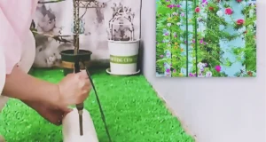 A tall white PVC pipe planter filled with portulaca cuttings and colorful moss rose flowers, creating a vertical flower tower for a small balcony or patio garden.