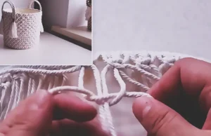 A handmade macrame storage basket made from a recycled plastic bucket, covered with cream rope knots, fabric lining, braided handles, and tassel accents.